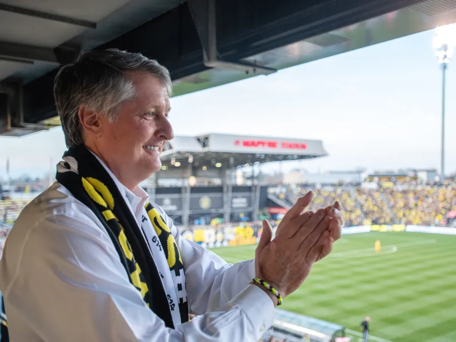 Dr. Pete Edwards cheers for Columbus Crew SC from his seat inside Mapfre Stadium