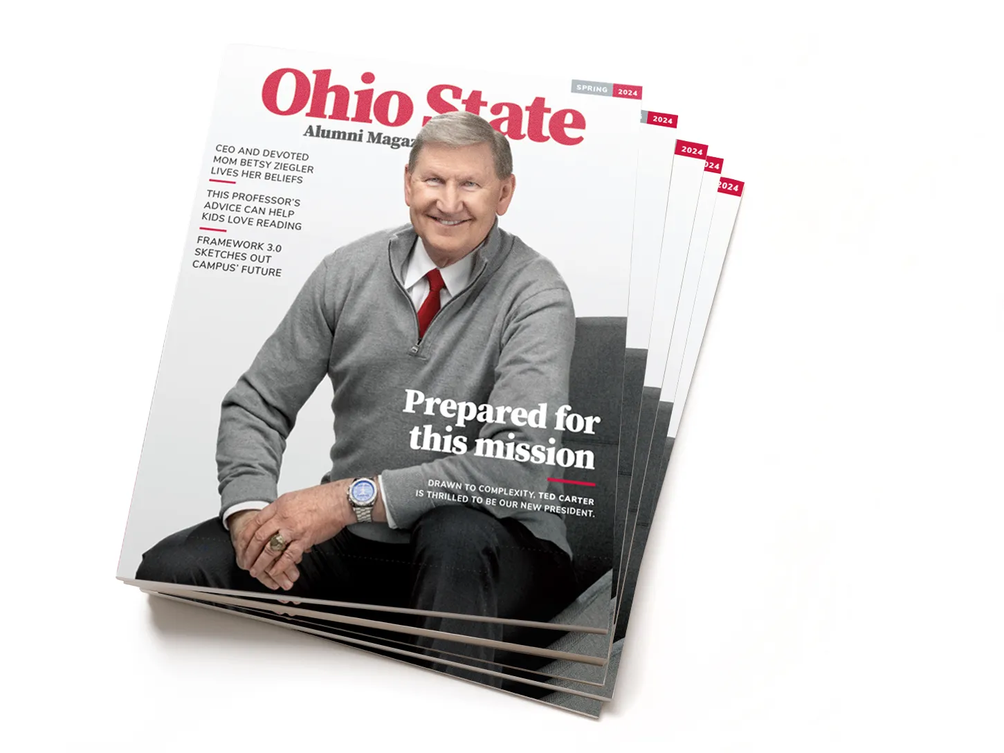 A stack of the spring issue of Ohio State Alumni Magazine. The cover shows Ted Carter, university president, who is smiling while posing. He’s sitting on a chair, leaning slightly toward the viewer, with his hands loosely clasped. He comes across as a friendly grandpa or an approachable professor—the kind who’s easy to talk to and interesting to talk to.