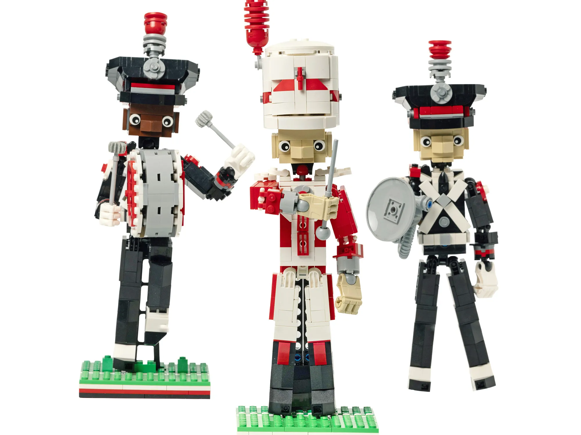 Three marching band members are built out of legos--a drum major, a bass drum player and a sousaphone player