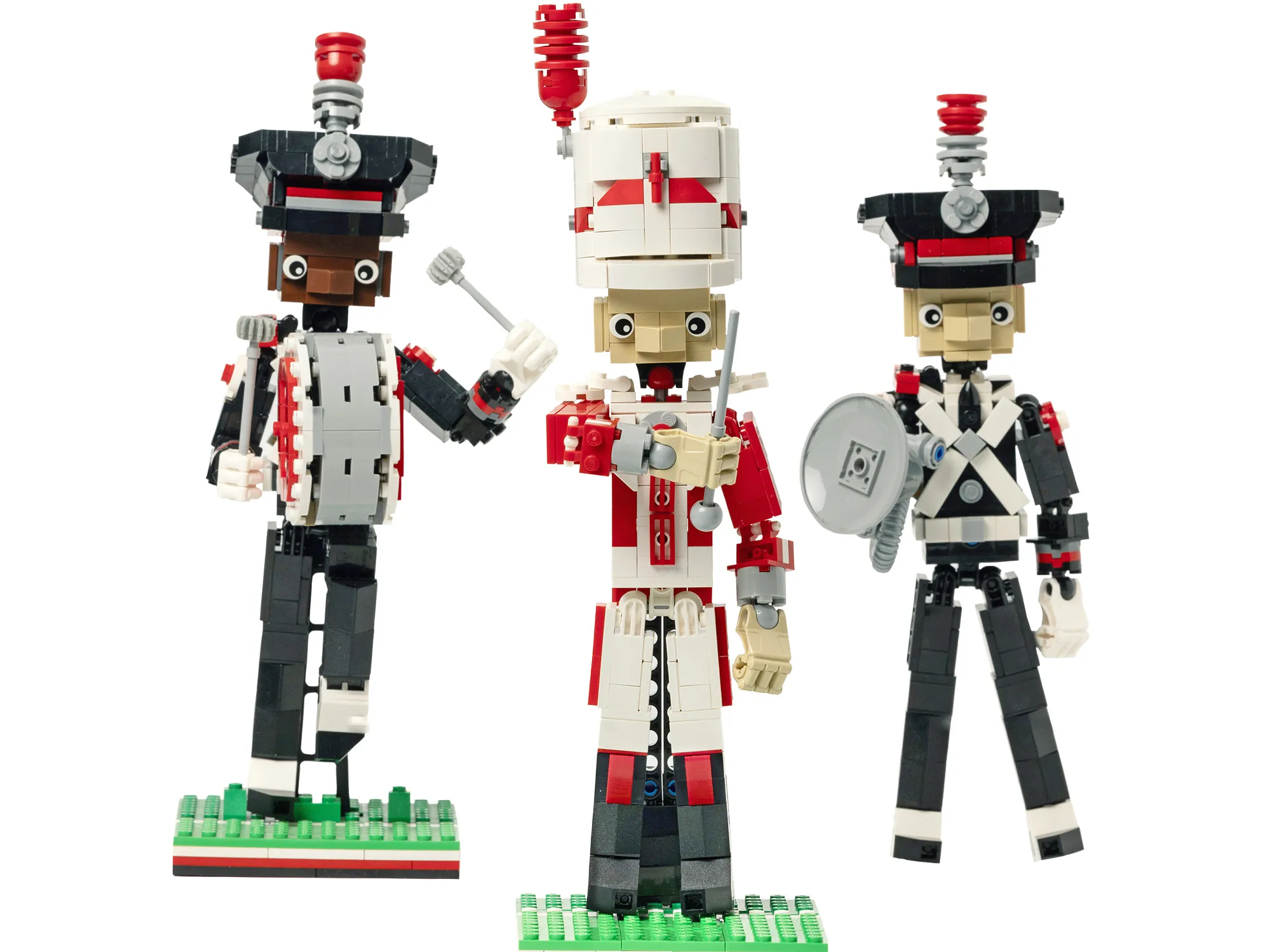 Three marching band members are built out of legos--a drum major, a bass drum player and a sousaphone player