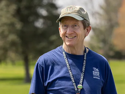 Bradley Lepper smiles as he speaks with visitors to the Great Circle Earthworks in Newark