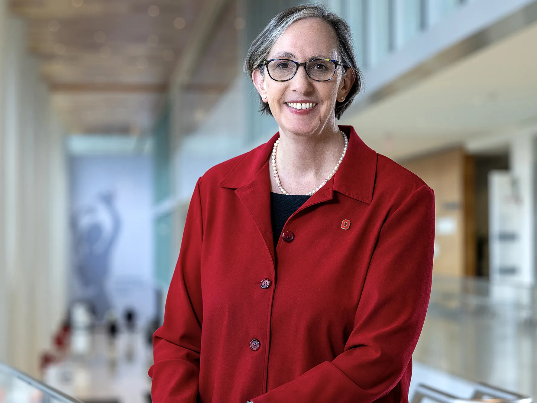 Dr. W. Kimryn Rathmell, the new leader of Ohio State&#039;s James Cancer Hospital, poses for this portrait. She is a white woman with hair cut just below chin-length, glasses and a friendly smile.