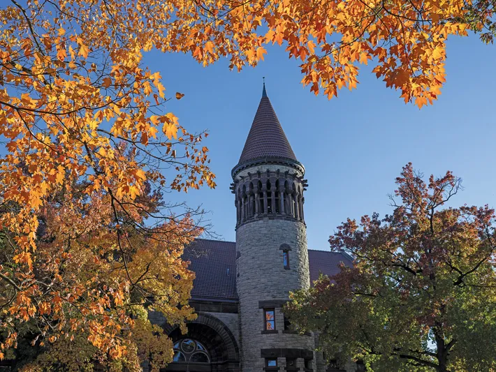 A photo shows the bell tower of Orton Hall, as seen from the Oval