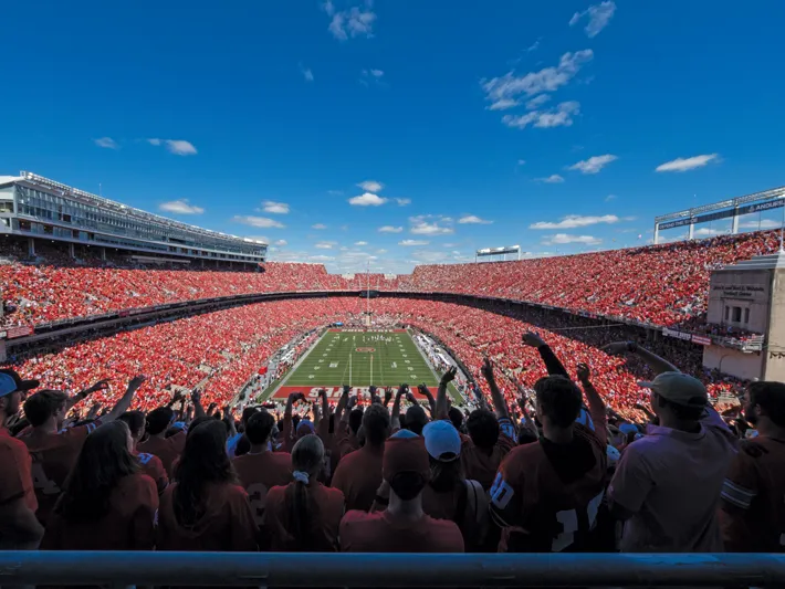 A packed Ohio Stadium on a gorgeous game day shows a sea of Ohio State colors as worn by cheering fans