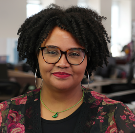 Erica Thompson is a pretty black woman with glasses, cool silver earrings and a close-lipped smile that seems 100% genuine